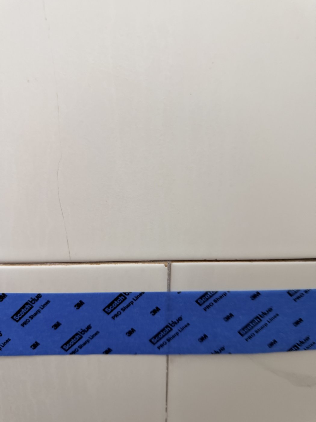 Hairline crack running through shower wall tile in Taylors, SC