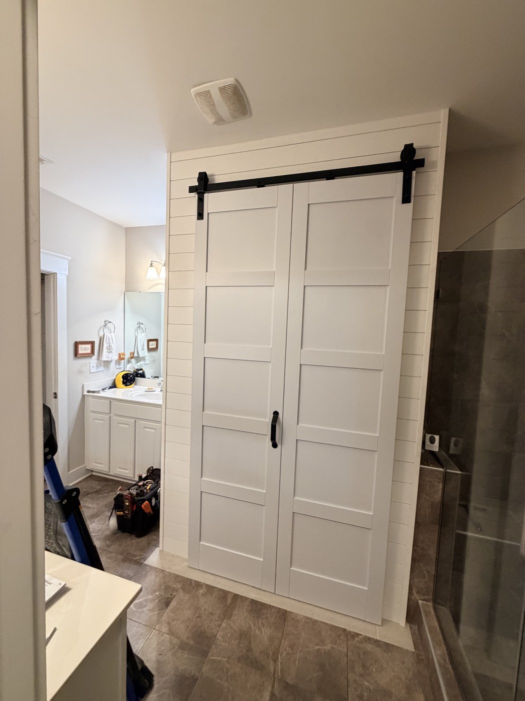 Garden tub converted to a first-floor laundry room during a bathroom remodel by Tile Yoda